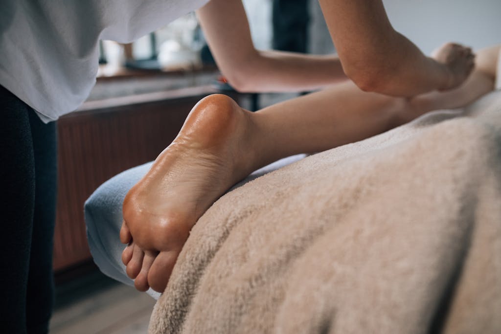 A soothing foot massage in a calming indoor setting, promoting relaxation and self-care.