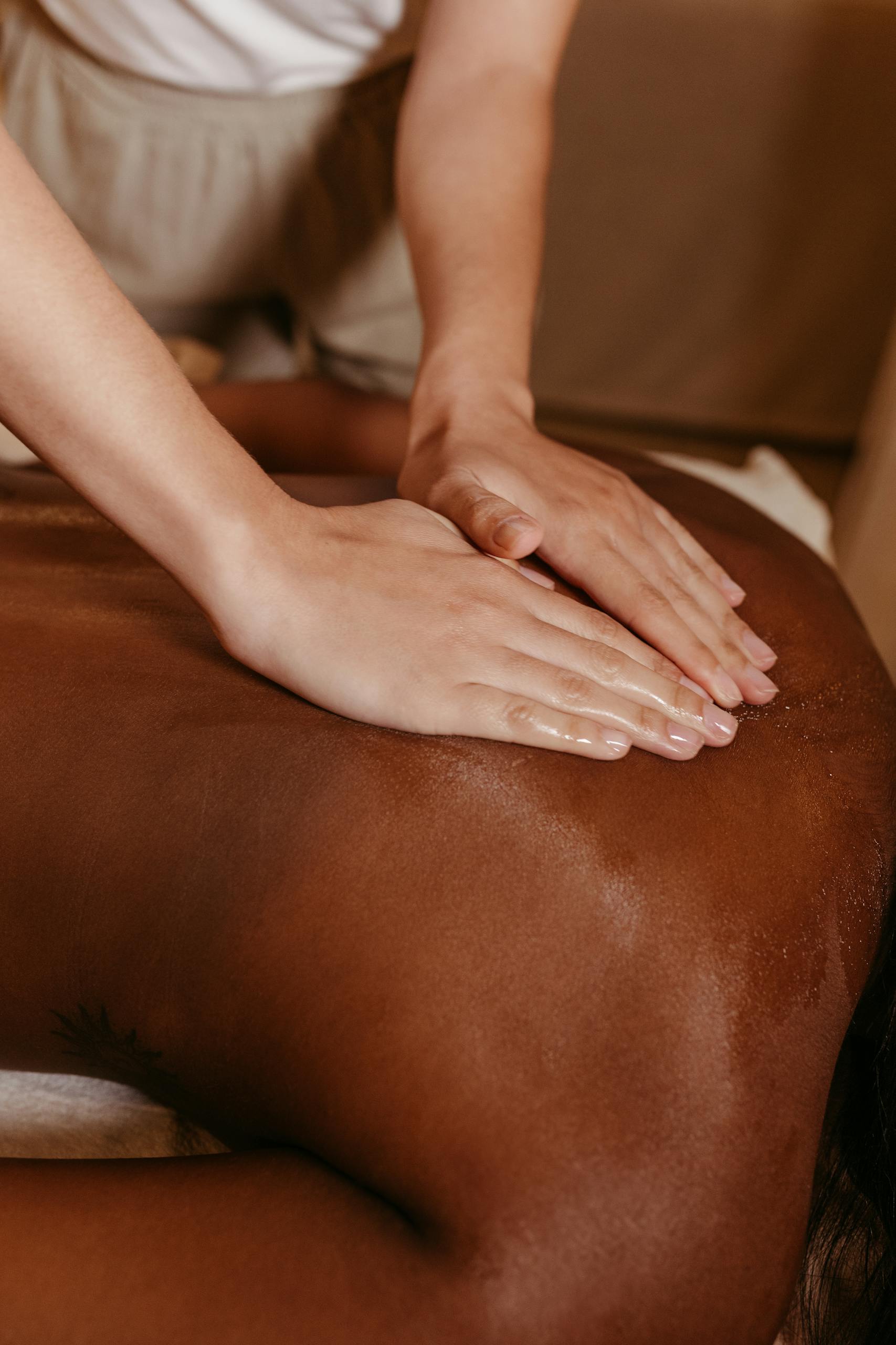 A soothing massage therapy session promoting relaxation and wellbeing in a tranquil spa environment.