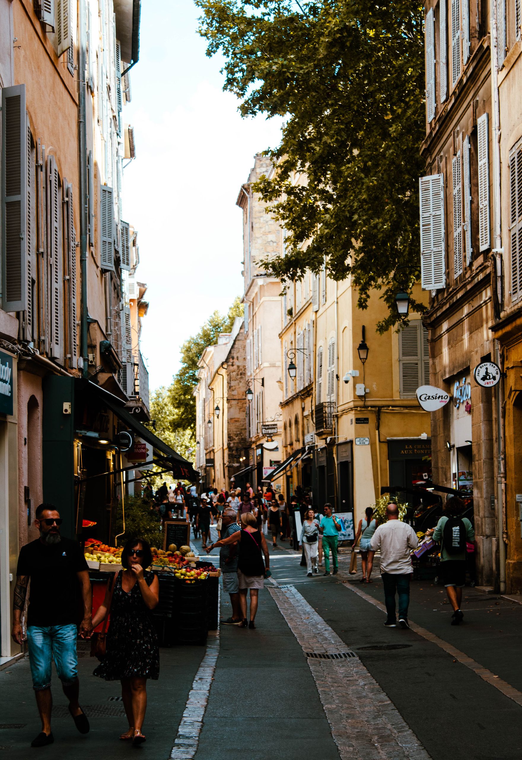 Explore the vibrant streets of Aix-en-Provence, capturing the essence of summer and local life.
